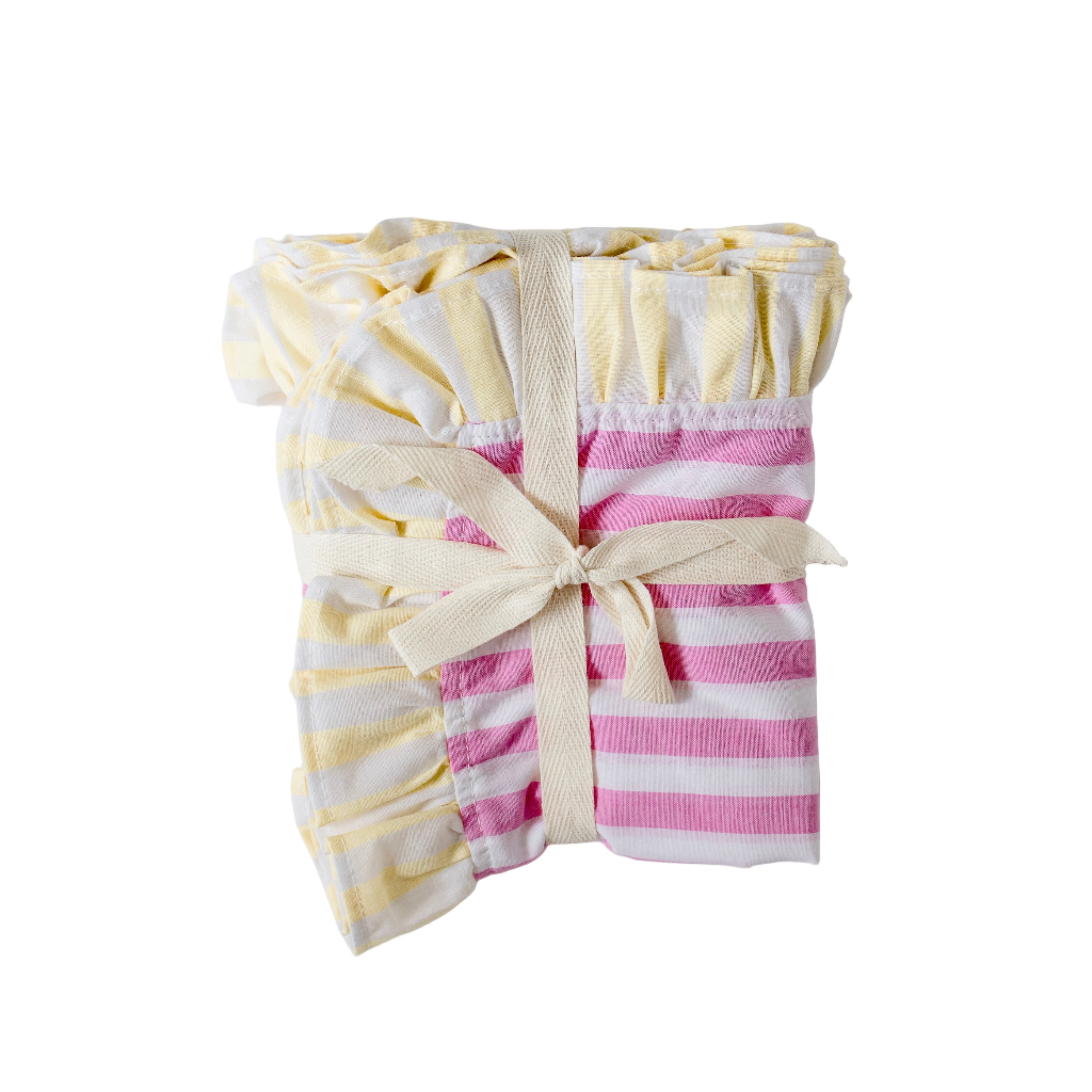 Soft pastel striped cotton placemats in pink and yellow with delicate frilled edges styled for a cottagecore garden brunch