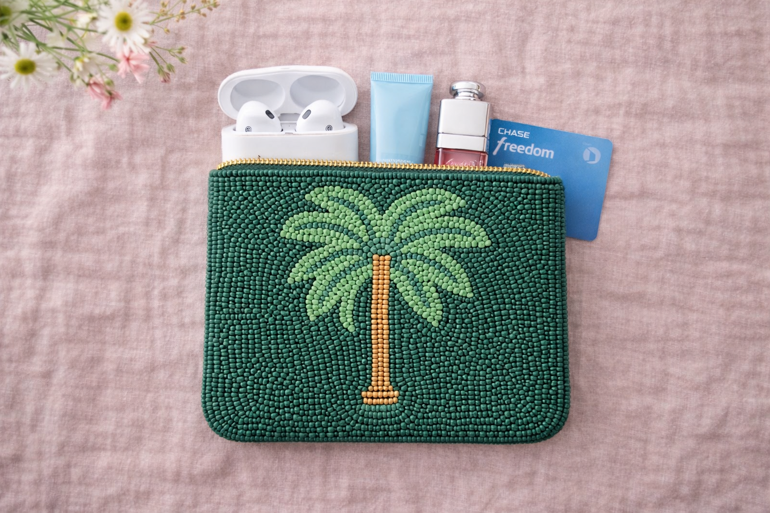 Small embroidered coin pouch with coins AirPods and lipstick