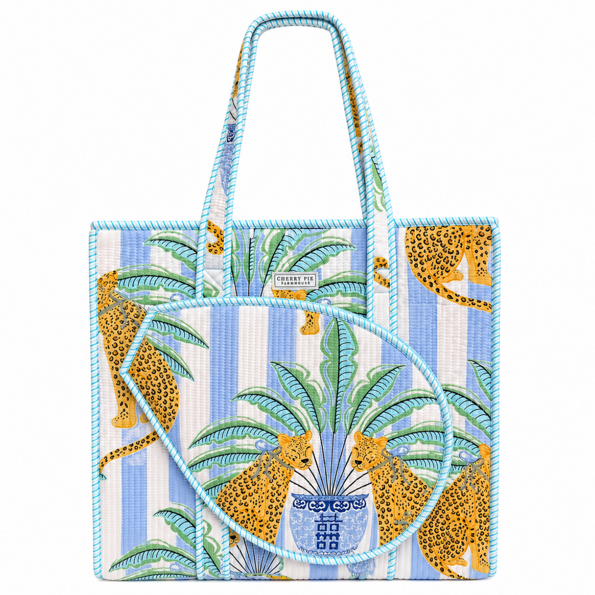 Blue striped quilted racquet tote bag with palm and leopard print and front tennis and padel racquet compartment by Cherry Pie Farmhouse