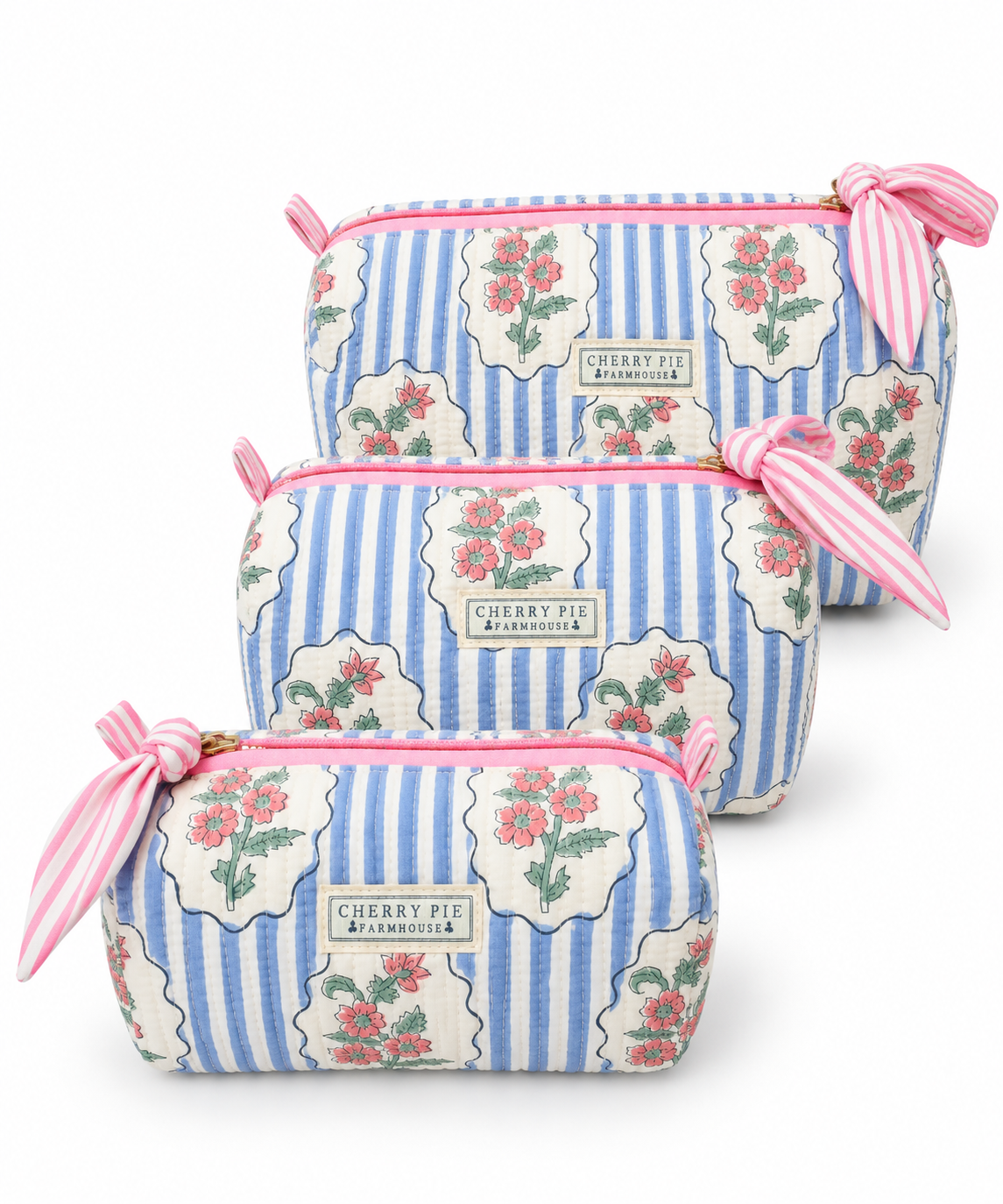 Bluebell Cottage quilted cotton zipper pouches in Small, Medium and Large on a white background.
