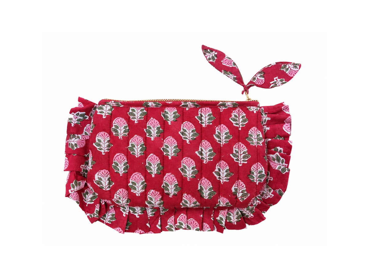 Cherry red quilted cotton frill pouch with pink floral block print and gold zipper on a white background