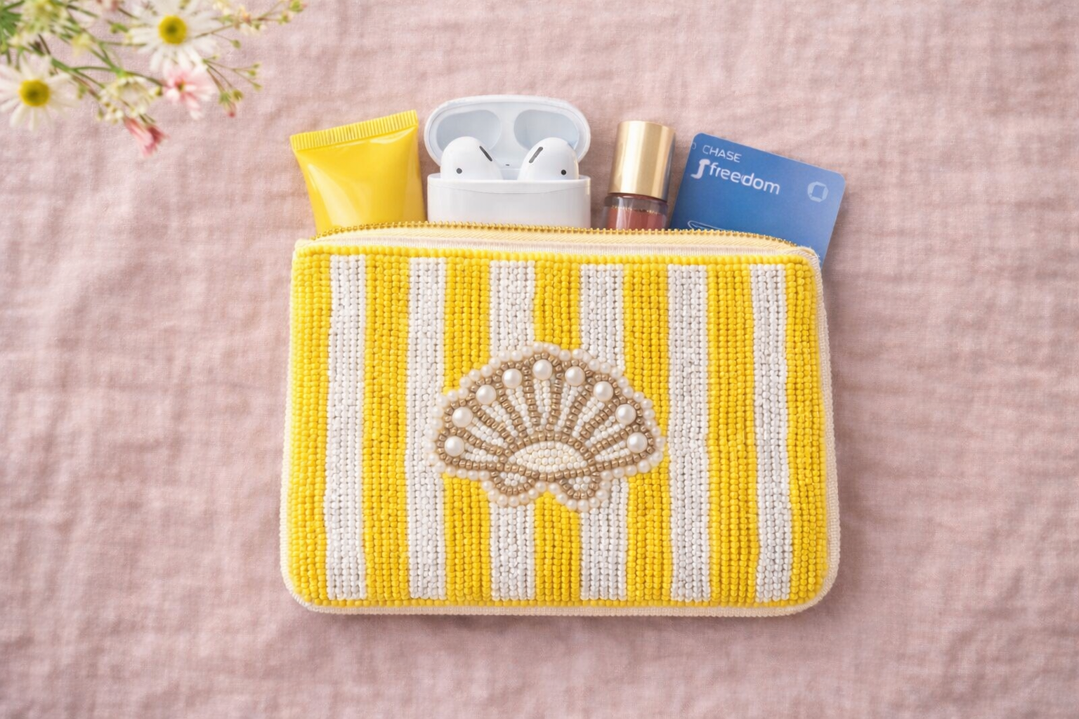 Small embroidered coin pouch with coins cards AirPods and lipstick