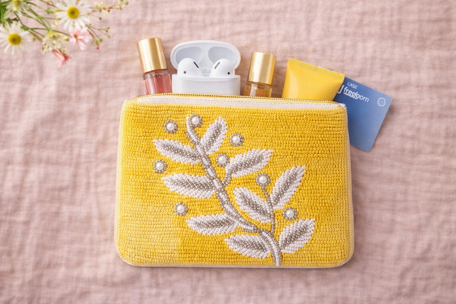 Small embroidered coin pouch with coins cards AirPods and lipstick