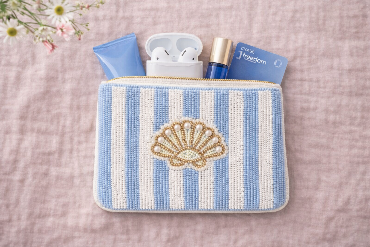 Small embroidered coin pouch with coins cards AirPods and lipstick