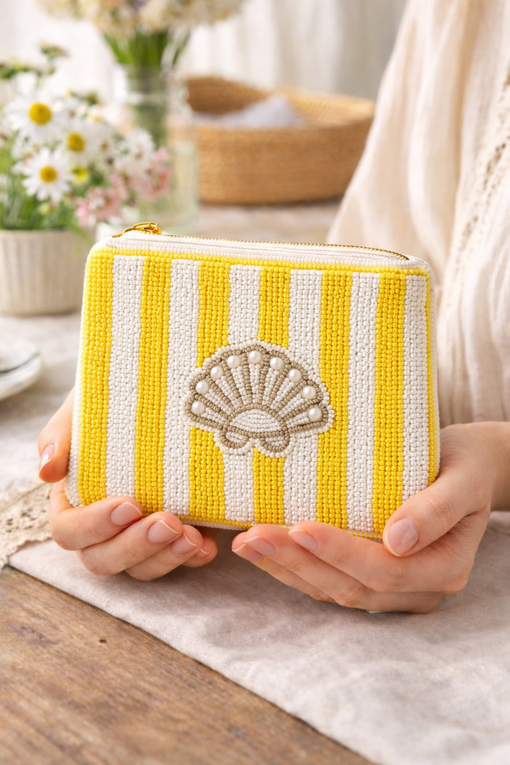 Close up detail of hand embroidered beaded apricot seashell coin pouch