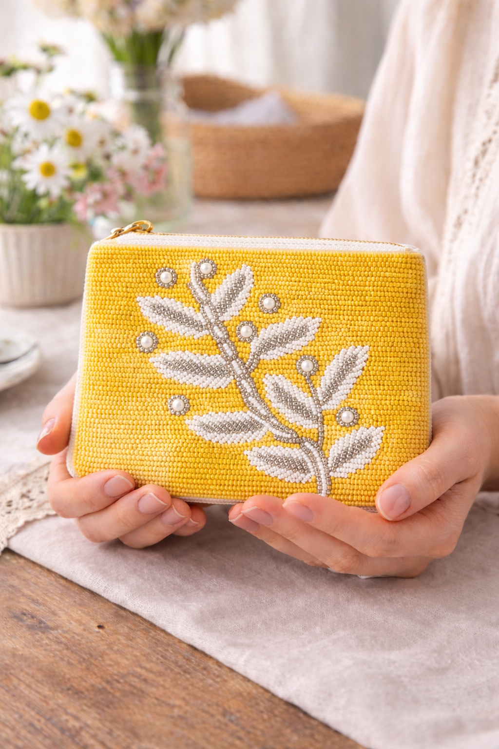 Close up detail of hand embroidered beaded mustard yellow leaf coin pouch