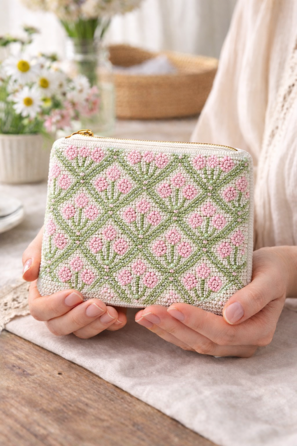 Close up detail of hand embroidered beaded pink block print motif coin pouch
