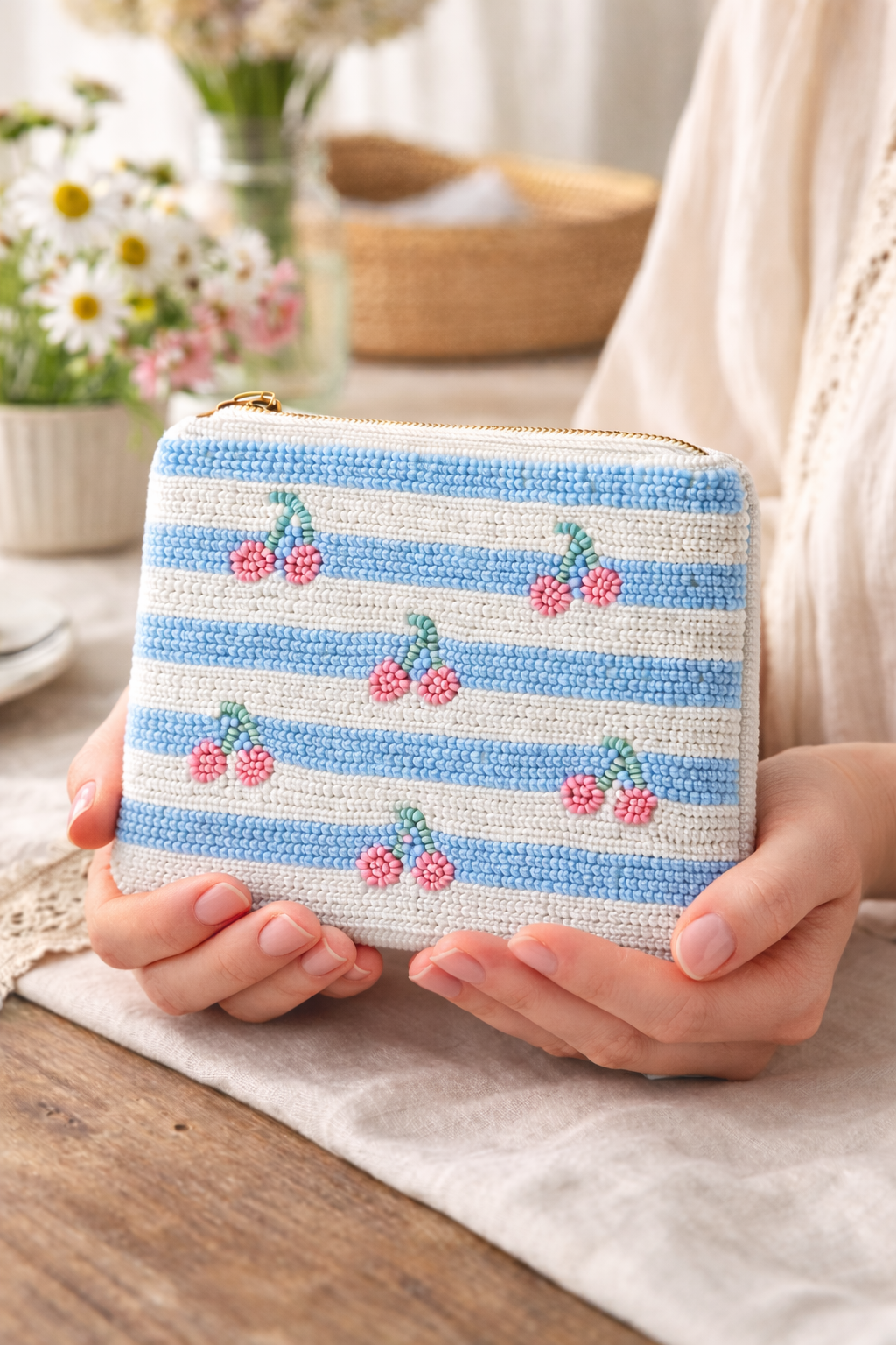 Cottagecore embroidered coin pouch styled on pastel fabric