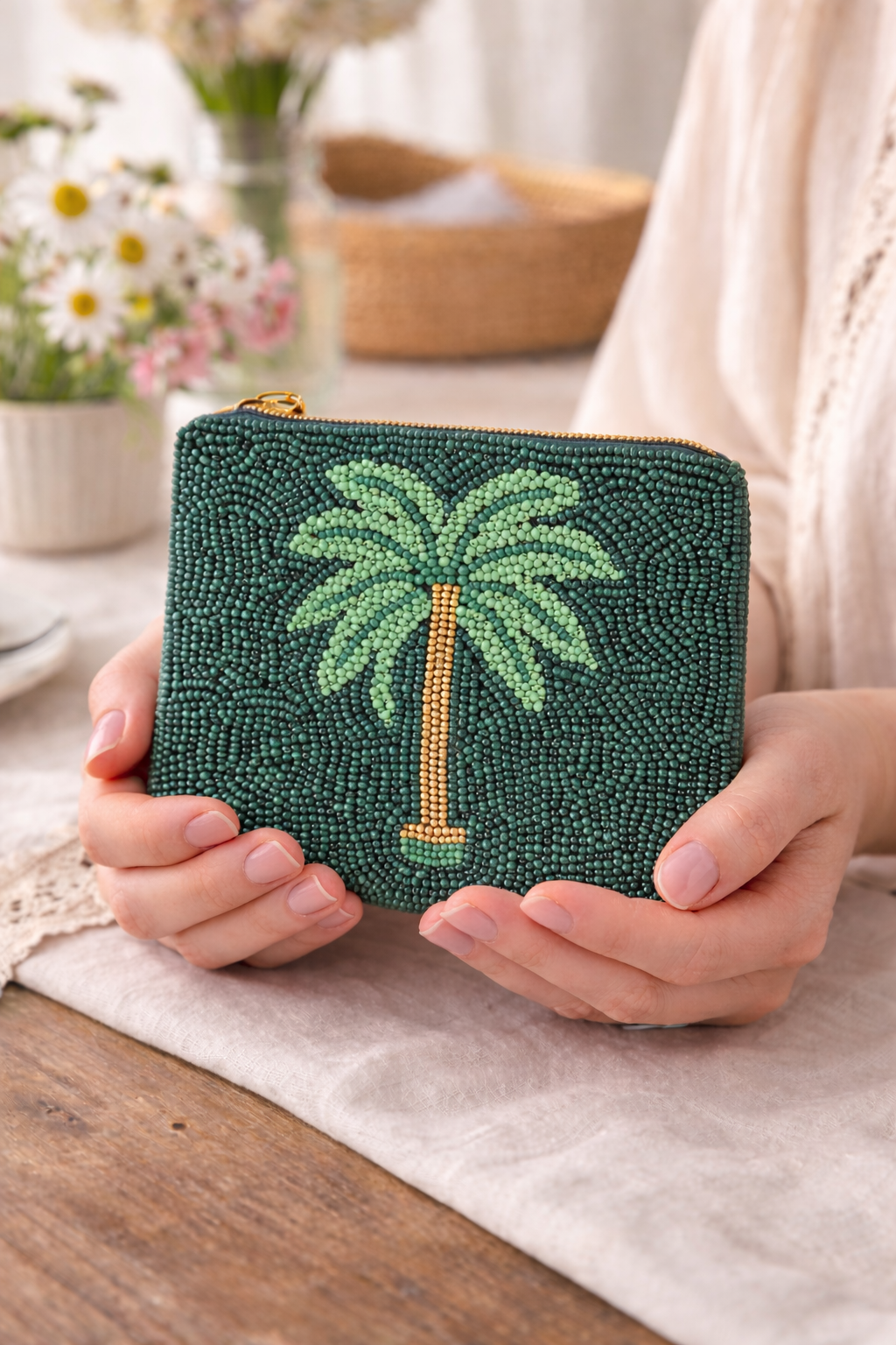 Close up detail of hand embroidered beaded green palm tree coin pouch