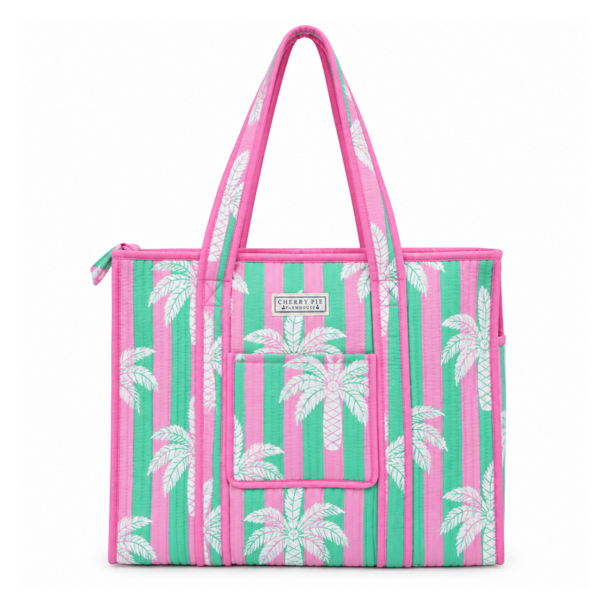 Pink and green striped quilted cotton tote with white palm print, front pocket and zip-top closure on a white background