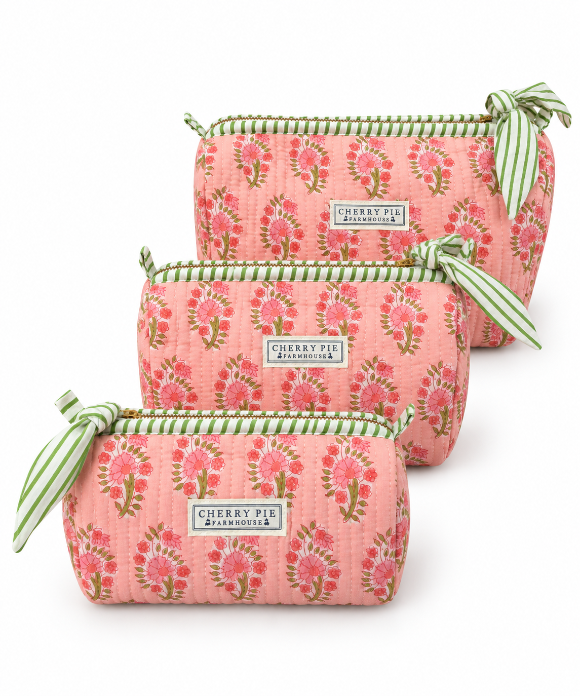 Rose Garden quilted cotton zipper pouches in Small, Medium and Large on a white background.