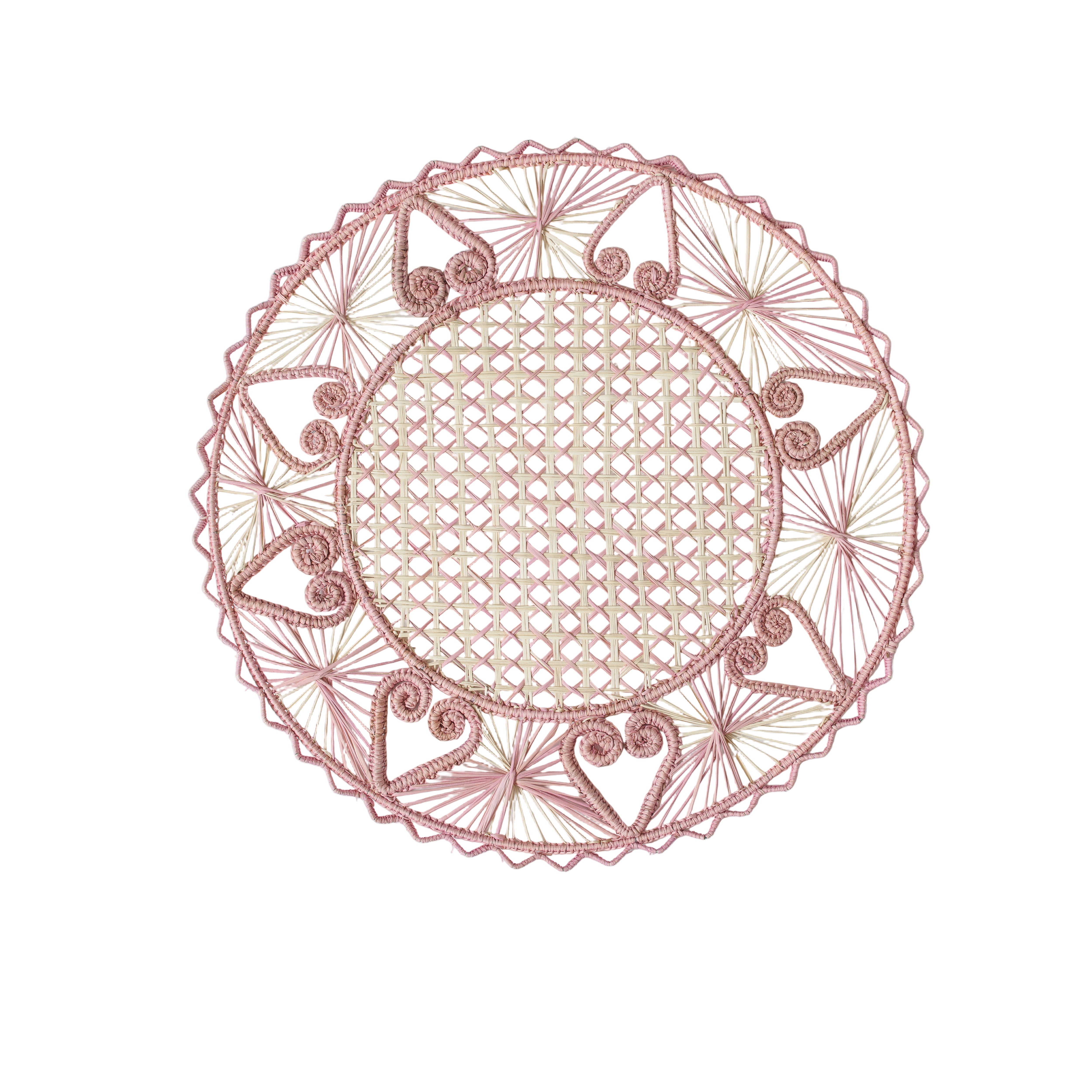 Round handwoven iraca palm placemats with hearts adding natural farmhouse texture to a rustic wooden table setting
