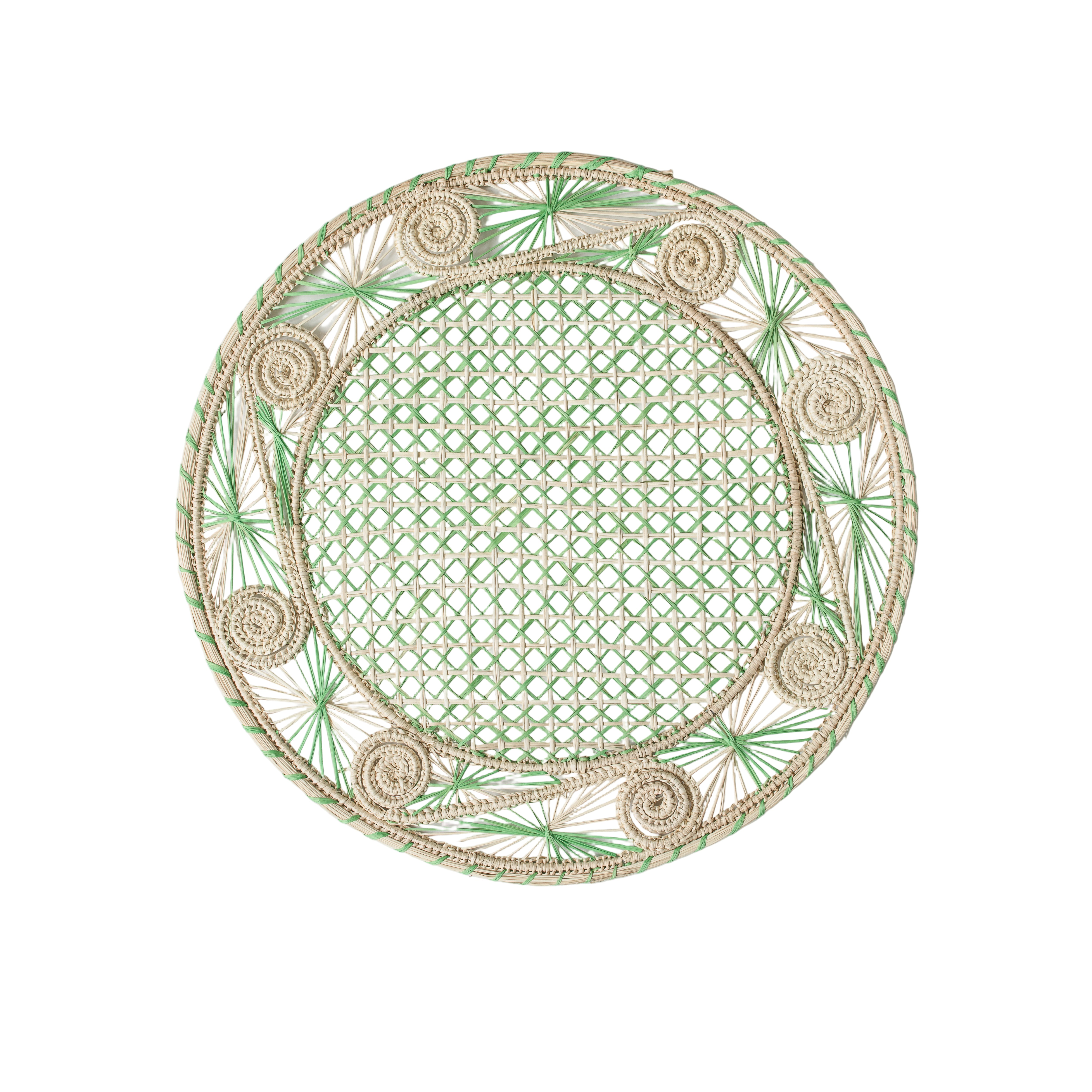 Round handwoven iraca palm placemats in green adding natural farmhouse texture to a rustic wooden table setting