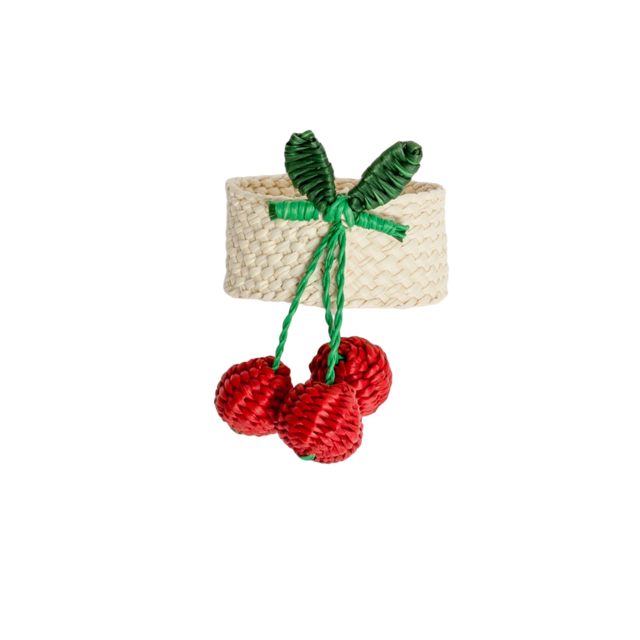 Handcrafted iraca palm cherry napkin rings wrapped around linen napkins on table
