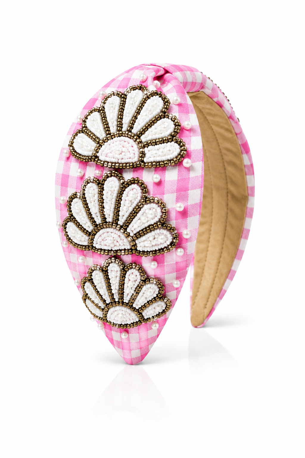 Pink headband with decorative white and gold patterns on a white background