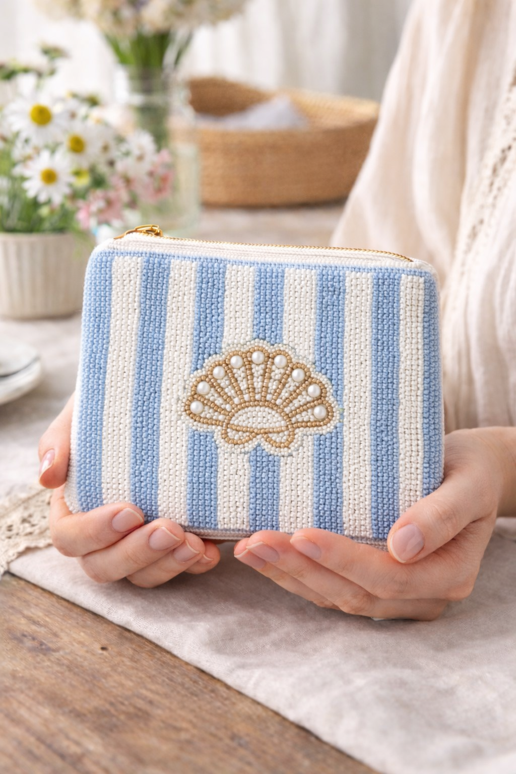Close up detail of hand embroidered beaded striped blue white seashell coin pouch