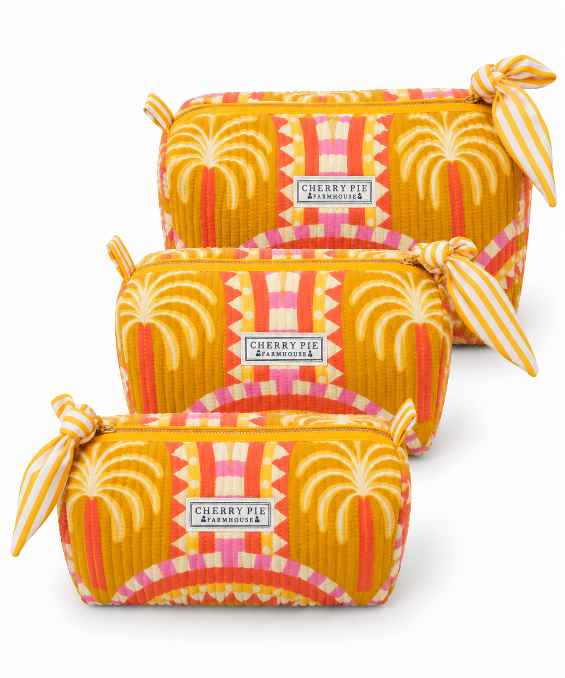 Golden Palm quilted cotton zipper pouches in Small, Medium and Large on a white background.