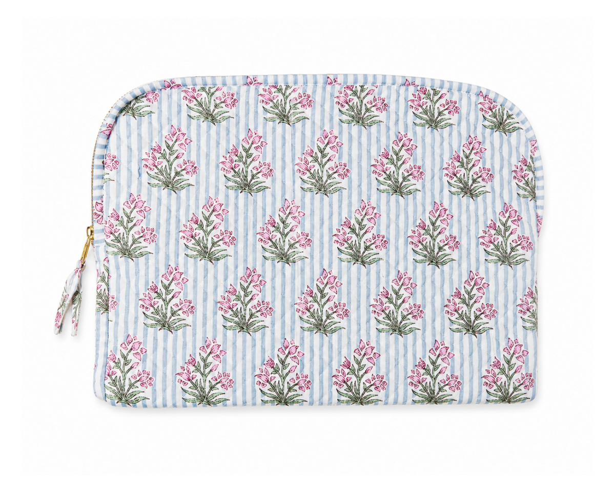 Cornflower quilted laptop sleeve with blue stripes, pink floral sprigs and gold zipper on white