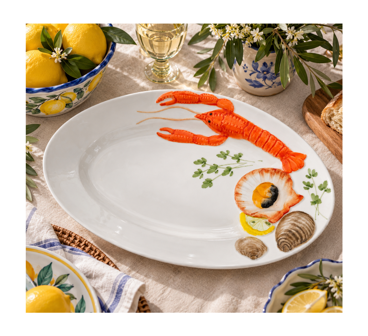 Hand-painted Italian ceramic lobster serving plate styled on a farmhouse table.