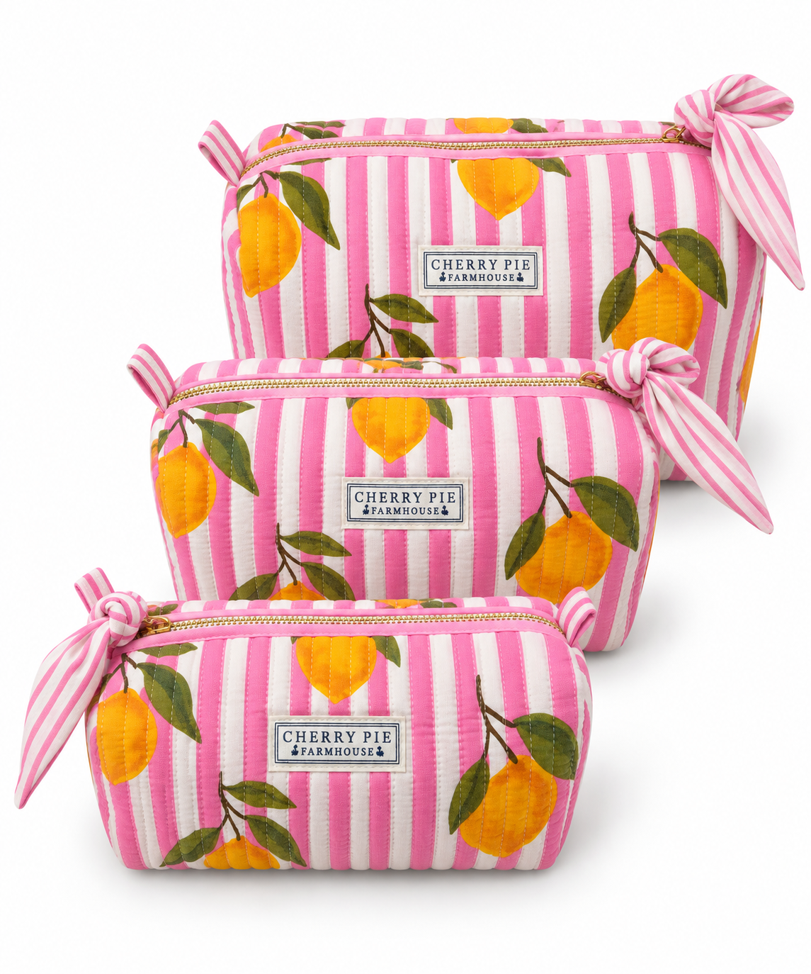 Pink Lemon Grove quilted cotton zipper pouches in Small, Medium and Large on a white background.