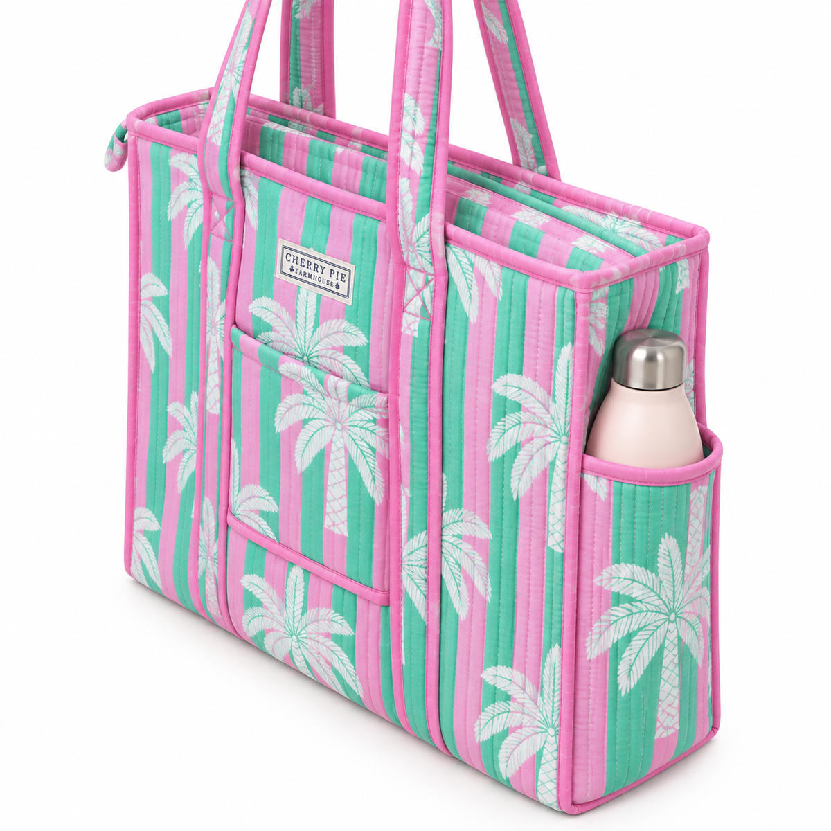 Side view of pink and green palm-print quilted tote showing the outer bottle pocket and concealed zip closure