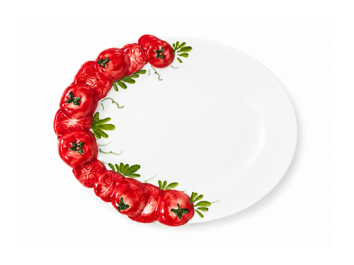 White oval hand-painted Italian ceramic plate with sculpted red tomatoes and green leaves