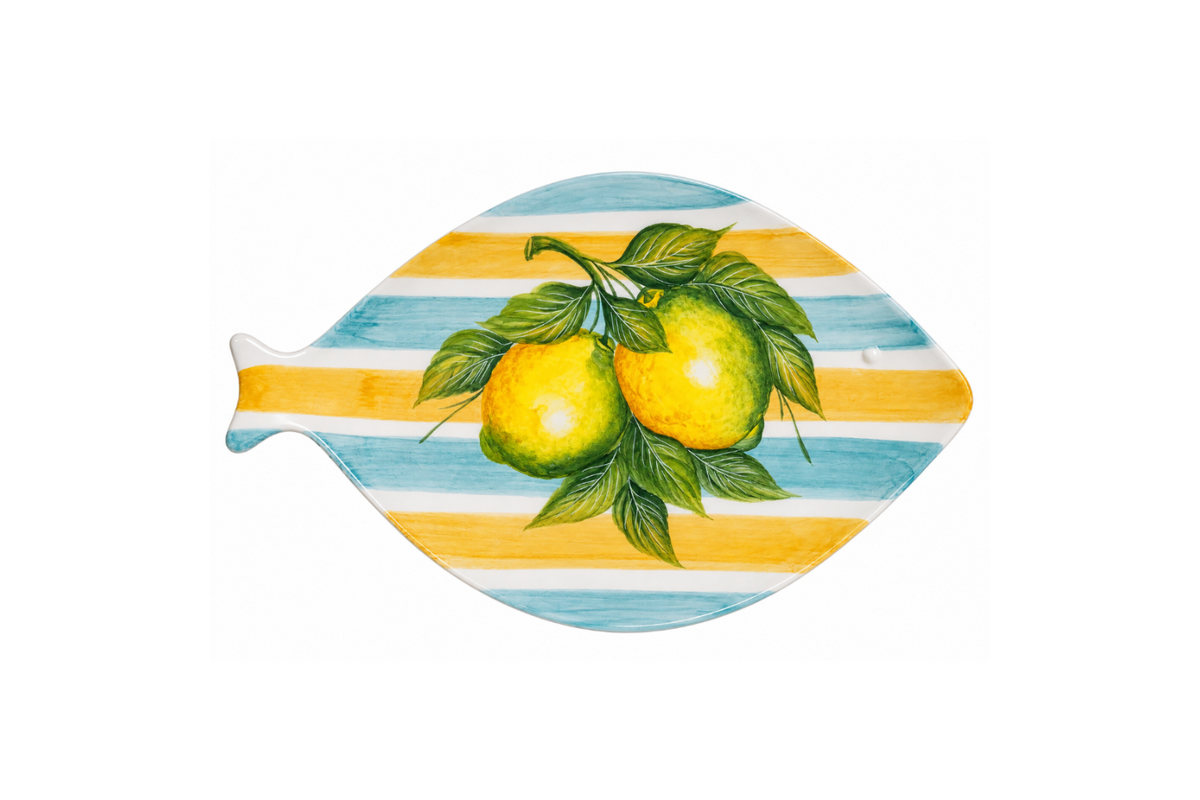 Fish-shaped ceramic platter hand-painted with lemons, green leaves, and blue and yellow stripes.